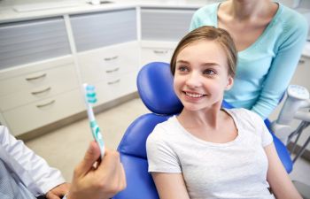 girl in dental chair during dentist appointment