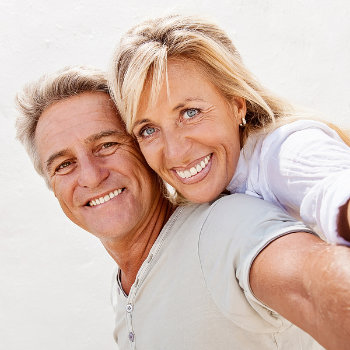 mature couple smiling at the camera