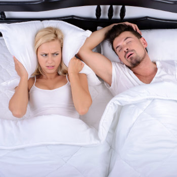 the woman cant sleep because her partner is snoring