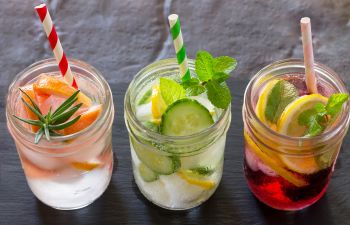 three jars of water with fruits